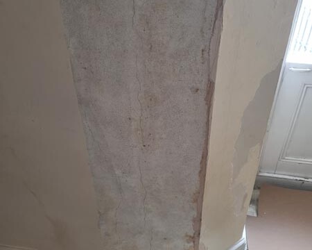 Damaged Wall Before Interior Decorating